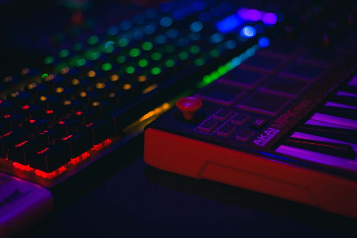 Close-up of a colorful illuminated keyboard and music controller.
